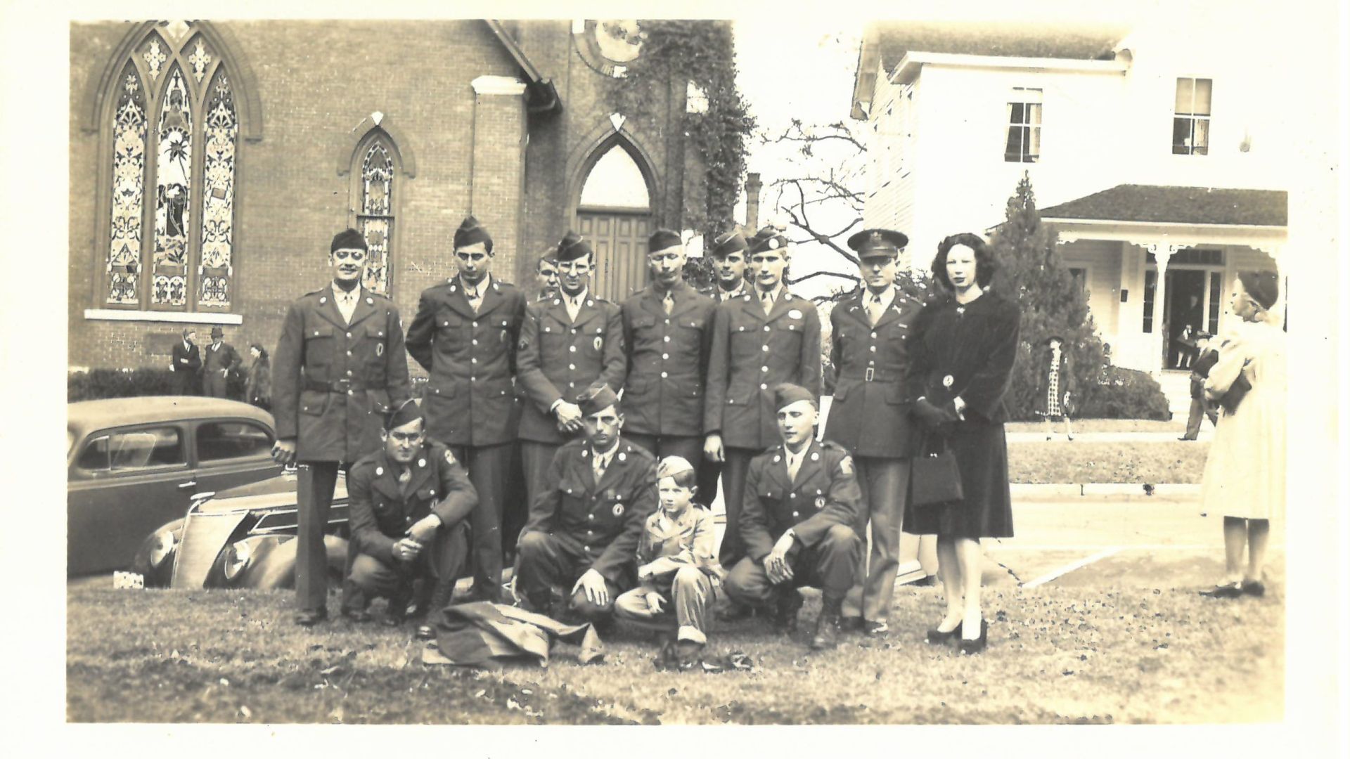 Vintage sepia photo of WWII servicemen outside of Trinity United Methodist Church