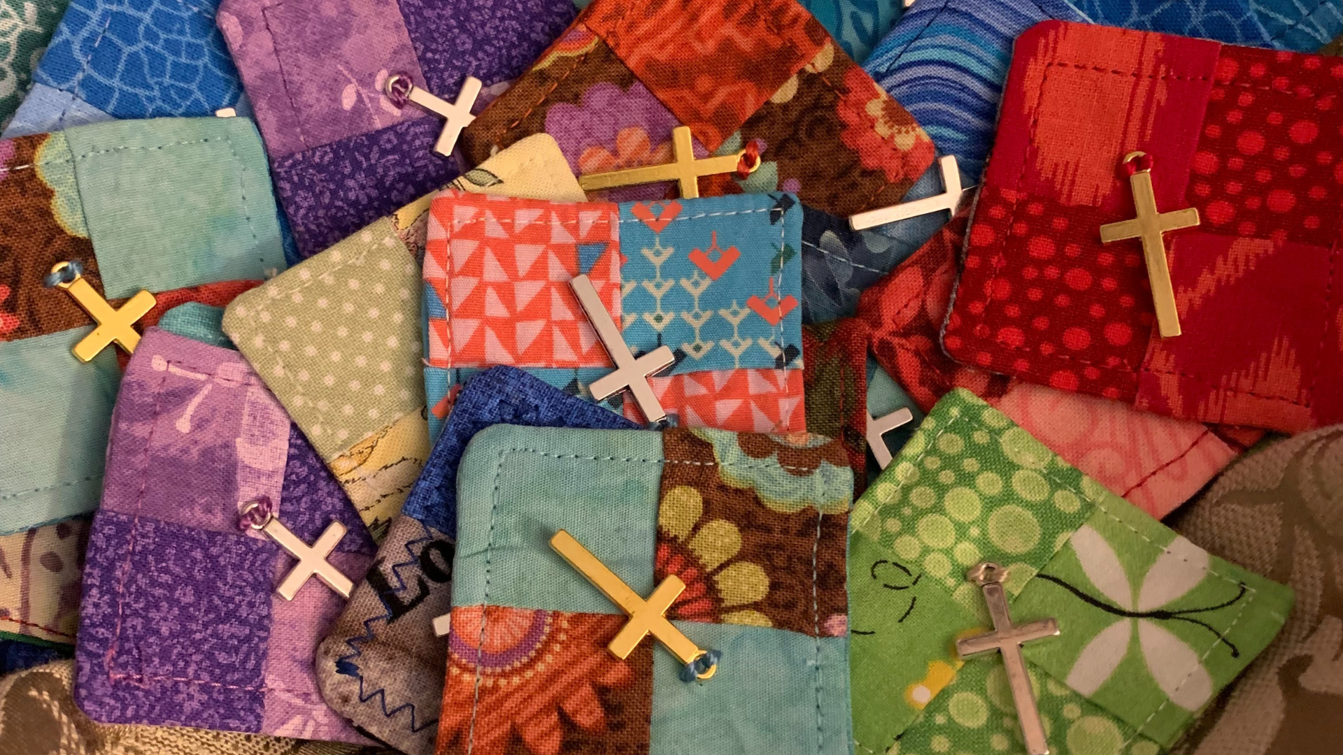 Colorful pocket prayer quilts with crosses