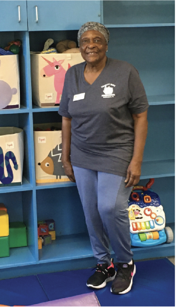 Teacher Victoria Tettey standing in the infant room 